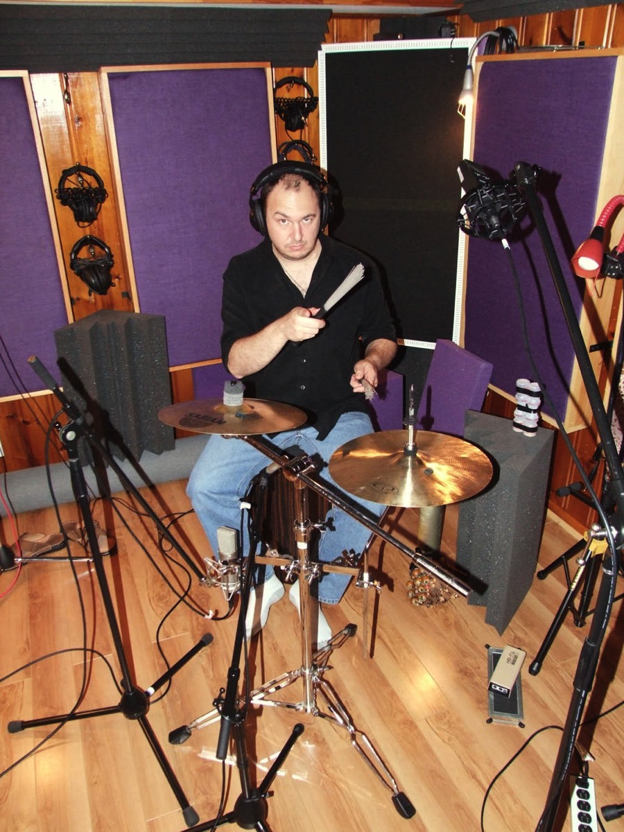 Tiago playing Brazilian percussion